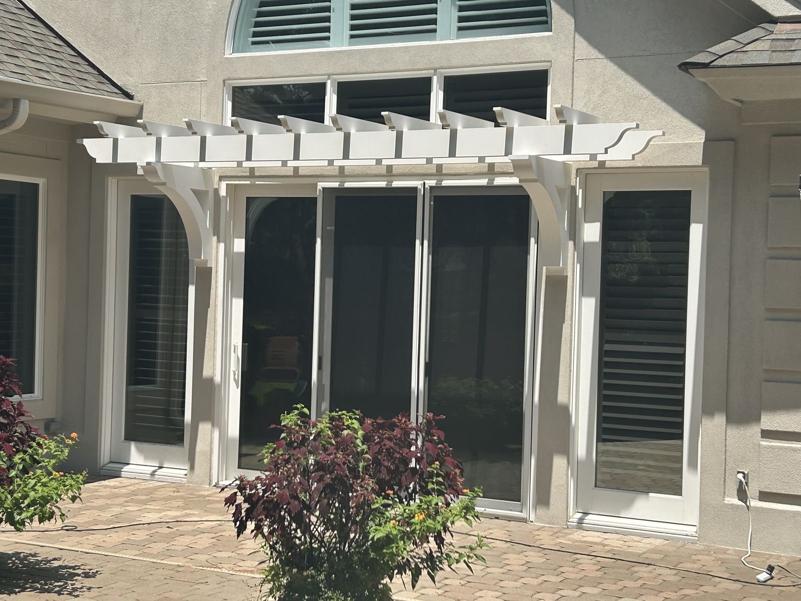 Pergola over new patio doors on a paver patio by Burson Construction, Bluffton SC