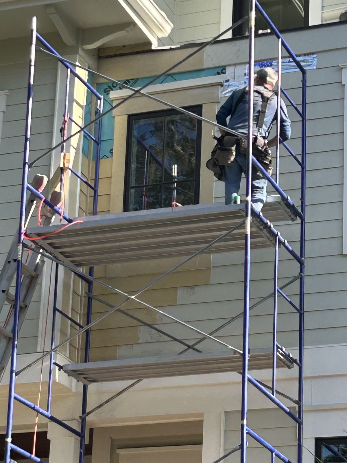 Siding and window replacement from scaffolding by Burson Construction, Bluffton SC
